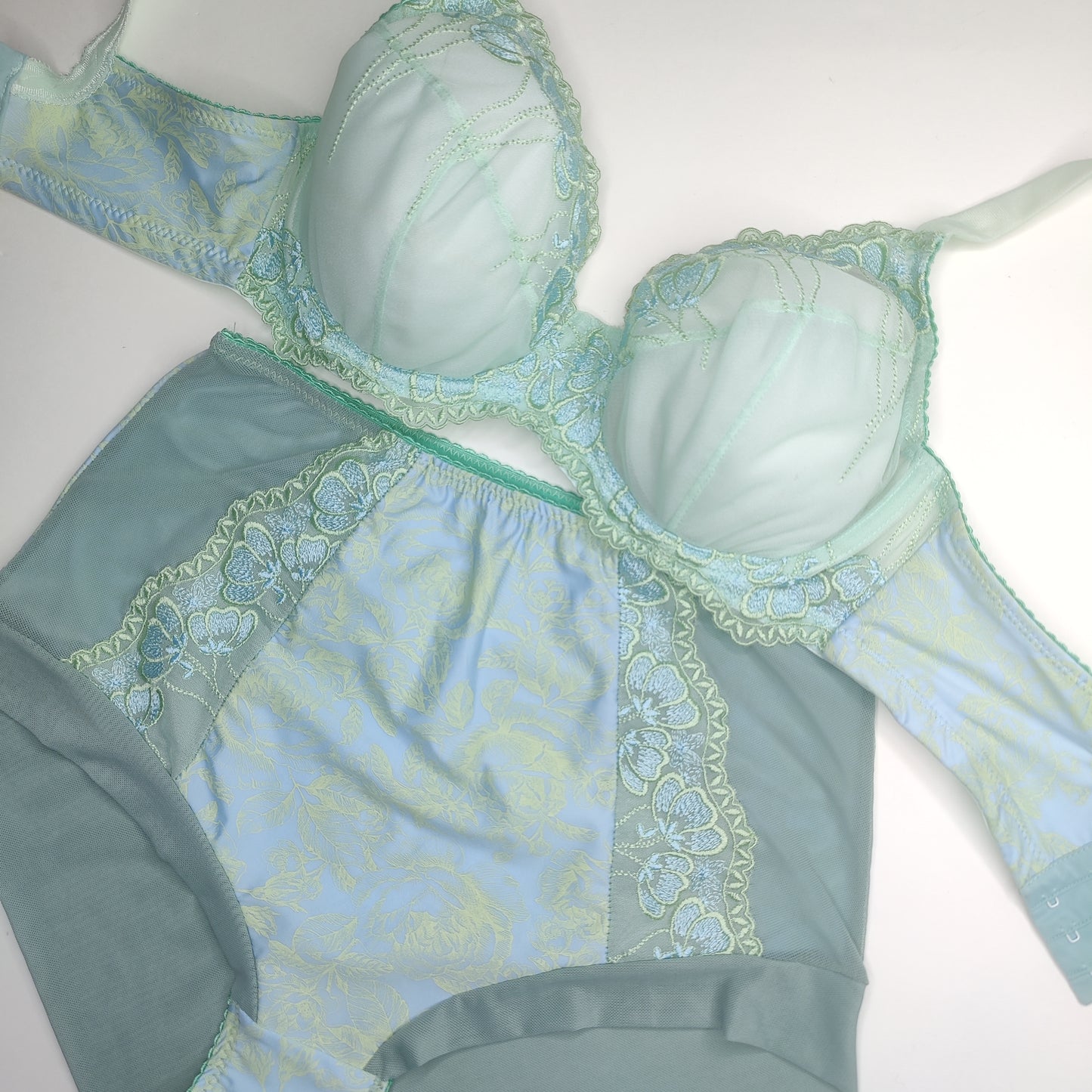 Embroidery on tulle in light green and light blue, with vertical floral pattern, multicolored. Embroidery lace. IDstx9