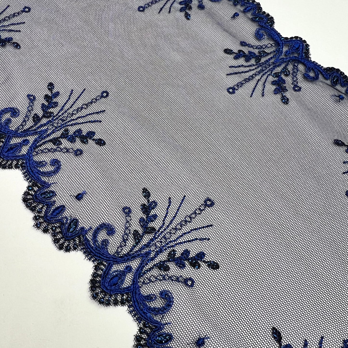 1 m elastic embroidery lace border on fine tulle with lurex thread in dark blue. IDsx4