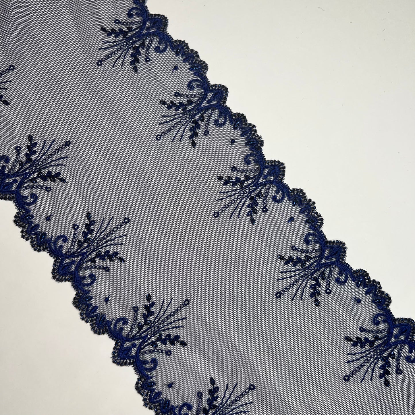 1 m elastic embroidery lace border on fine tulle with lurex thread in dark blue. IDsx4