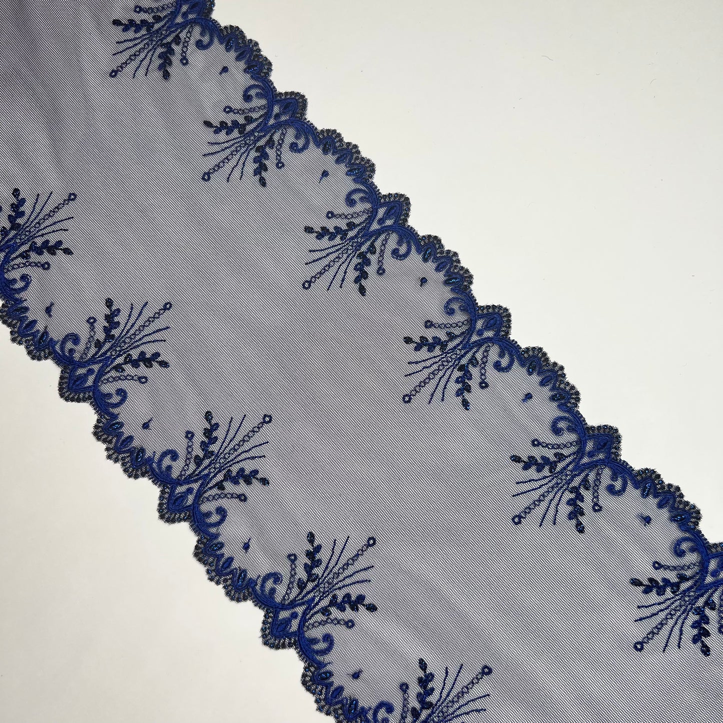 1 m elastic embroidery lace border on fine tulle with lurex thread in dark blue. IDsx4