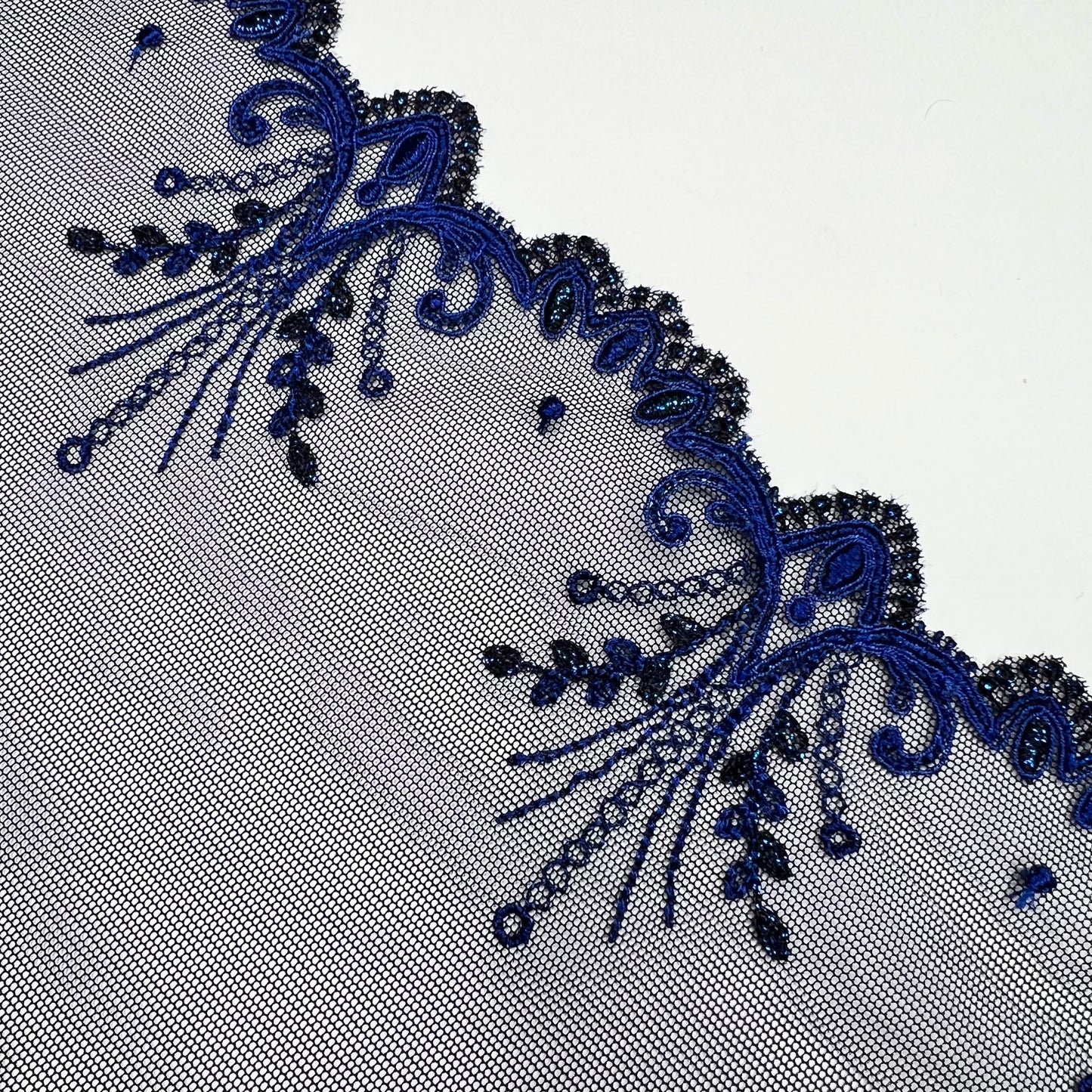 1 m elastic embroidery lace border on fine tulle with lurex thread in dark blue. IDsx4