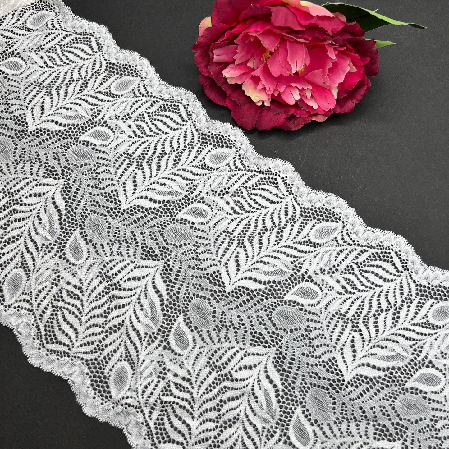 Wide elastic lace in white, price per 1/2 meter
