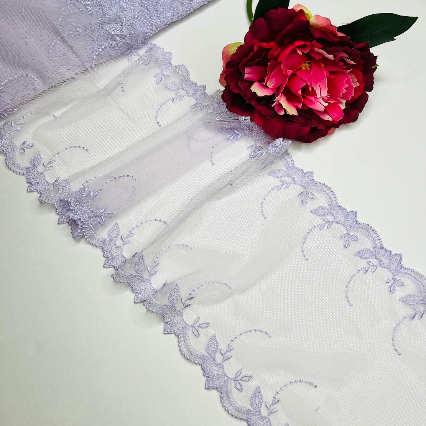 1 m elastic embroidered lace trim on fine tulle in pastel lavender. IDsx4